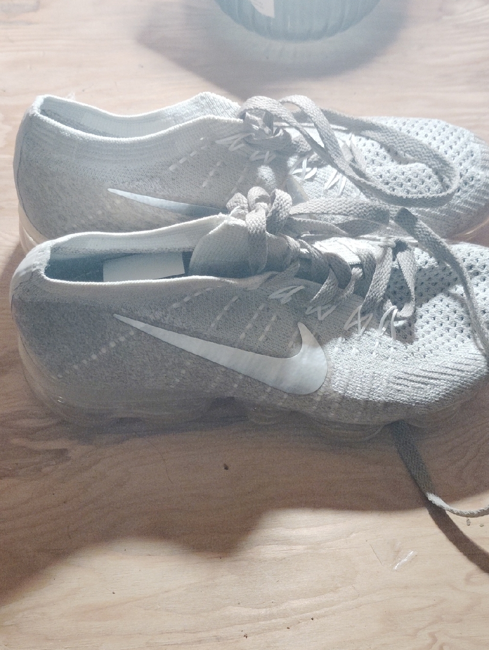Nike Light Gray Flyknit Sneakers with White Swoosh